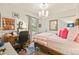 Bedroom with a chandelier, hardwood floors and a desk area by the window at 2131 Eliot St, Denver, CO 80211