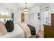 Bright bedroom with white walls, hardwood floors, and natural light from the window at 2131 Eliot St, Denver, CO 80211