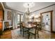 Charming dining room with hardwood floors, natural light, and classic chandelier at 2131 Eliot St, Denver, CO 80211
