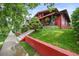 A charming house with a brick facade, manicured lawn, and inviting front porch at 2131 Eliot St, Denver, CO 80211