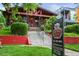Charming brick home with eye-catching curb appeal and professional real estate signage at 2131 Eliot St, Denver, CO 80211