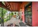 Cozy front porch featuring comfortable seating, a brick floor, and charming decor elements at 2131 Eliot St, Denver, CO 80211