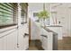 Stairway with laundry area, lots of light, and decorative wall art at 2131 Eliot St, Denver, CO 80211