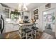 Stylish kitchen with white cabinets, subway tile backsplash, and butcher block island at 2131 Eliot St, Denver, CO 80211