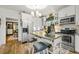 Bright kitchen with white cabinets, stainless steel appliances, and a butcher block island at 2131 Eliot St, Denver, CO 80211