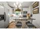 Charming kitchen with white cabinets, stainless steel appliances, and butcher block island at 2131 Eliot St, Denver, CO 80211