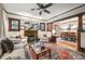 Inviting living room with vintage fireplace, large windows, and adjacent dining area at 2131 Eliot St, Denver, CO 80211