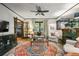 Cozy living room featuring a decorative rug, fireplace, and French doors to other rooms at 2131 Eliot St, Denver, CO 80211