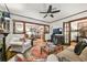 Bright living room showcases the open layout, decorative rug, fireplace and access to multiple rooms at 2131 Eliot St, Denver, CO 80211