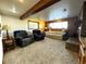 Finished basement with seating area and brick fireplace at 1927 S Xenon St, Lakewood, CO 80228