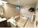 Basement bathroom with a large jetted tub at 1927 S Xenon St, Lakewood, CO 80228