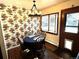 Cozy kitchen dining area with floral wallpaper and wood table at 1927 S Xenon St, Lakewood, CO 80228