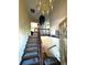 Two-story entryway with chandelier and wood staircase at 1927 S Xenon St, Lakewood, CO 80228