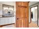 A neutral toned bathroom offers sleek granite countertops and a modern aesthetic at 8851 Blue Creek Rd, Evergreen, CO 80439
