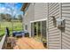 Wide angle view of the wooden deck with furniture and exterior of home at 8851 Blue Creek Rd, Evergreen, CO 80439