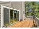 Beautiful wooden deck featuring views of the forest and backyard at 8851 Blue Creek Rd, Evergreen, CO 80439
