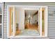 Welcoming foyer featuring beautiful hardwood floors, large bright yellow doors and a neutral color scheme throughout at 8851 Blue Creek Rd, Evergreen, CO 80439