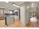 Kitchen with an island cooktop, stainless appliances, granite countertops and an adjacent dining area at 8851 Blue Creek Rd, Evergreen, CO 80439