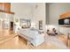 Open-concept living room boasts vaulted ceilings, wood floors, and ample natural light at 8851 Blue Creek Rd, Evergreen, CO 80439