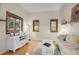 Comfortable living room with large windows offering scenic views and natural light at 8851 Blue Creek Rd, Evergreen, CO 80439