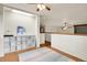 A loft features wood trim and a unique hexagonal light fixture at 8851 Blue Creek Rd, Evergreen, CO 80439