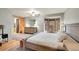 This main bedroom offers a bay window seating area and updated furniture at 8851 Blue Creek Rd, Evergreen, CO 80439