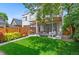 Beautiful backyard with a well-manicured lawn, patio seating, and modern pergola, perfect for outdoor entertaining at 3885 Vrain St, Denver, CO 80212