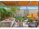 Beautiful backyard patio with stylish seating, pergola, and well-manicured lawn at 3885 Vrain St, Denver, CO 80212