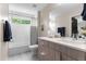 Well-lit bathroom featuring a tub-shower, modern vanity, and tasteful decor at 3885 Vrain St, Denver, CO 80212