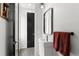 Contemporary half-bath featuring a sleek vanity, decorative mirror, and modern lighting at 3885 Vrain St, Denver, CO 80212