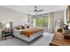 Bright bedroom with large windows, plush bedding, and a cozy, inviting atmosphere at 3885 Vrain St, Denver, CO 80212