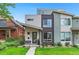 Modern townhome with a well-manicured lawn and unique architectural details on a sunny day at 3885 Vrain St, Denver, CO 80212
