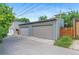 Spacious two-car garage with ample parking space and storage, featuring a neutral color scheme at 3885 Vrain St, Denver, CO 80212