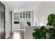 Bright hallway with hardwood floors, modern wine storage, and beautiful neutral paint at 3885 Vrain St, Denver, CO 80212