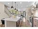 Modern kitchen with a center island, stainless steel appliances, and an open floor plan for easy entertaining at 3885 Vrain St, Denver, CO 80212