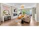 Bright living room with fireplace, hardwood floors, and sliding glass doors to the outdoor space at 3885 Vrain St, Denver, CO 80212