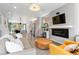 Spacious living room with an open floor plan leading to the kitchen and dining area at 3885 Vrain St, Denver, CO 80212