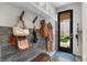 Well-organized mudroom with stylish storage, shelving and access to the outside at 3885 Vrain St, Denver, CO 80212