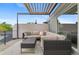 Relaxing rooftop deck with plush seating, pergola, and scenic views of the neighborhood at 3885 Vrain St, Denver, CO 80212
