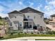 Spacious backyard with a deck, patio furniture, and a well-maintained lawn, great for outdoor living at 7265 S Millbrook Ct, Aurora, CO 80016