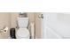 Neat bathroom with a standard toilet, showcasing practical design and space-saving features at 7265 S Millbrook Ct, Aurora, CO 80016