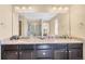 Bathroom features a double sink vanity with granite countertops, providing ample space and a touch of luxury at 7265 S Millbrook Ct, Aurora, CO 80016