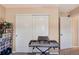 Bedroom featuring a large closet and an electric piano for a relaxing atmosphere and a wall-mounted display shelf at 7265 S Millbrook Ct, Aurora, CO 80016