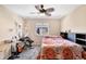 Relaxing bedroom with natural lighting and a ceiling fan, offering ample space and a tranquil retreat at 7265 S Millbrook Ct, Aurora, CO 80016