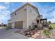 Back of home with attached two car garage and outdoor pergola and fence on nice lot at 7265 S Millbrook Ct, Aurora, CO 80016