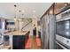 Gourmet kitchen with granite countertops, stainless appliances, and eat-in island seating at 7265 S Millbrook Ct, Aurora, CO 80016