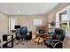 Bright office space with natural light, complete with desk, computer setup, and comfortable chairs at 7265 S Millbrook Ct, Aurora, CO 80016
