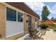 Charming brick home with a secure gated entrance and manicured rock landscaping at 12893 W Alameda Dr, Lakewood, CO 80228