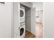 Bright laundry closet with modern stacked washer/dryer, perfect for space-saving convenience at 12893 W Alameda Dr, Lakewood, CO 80228