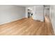 Spacious living area with hardwood floors leading to an open kitchen at 12893 W Alameda Dr, Lakewood, CO 80228